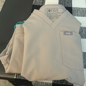 Sand figs scrubs. Pants are straight leg. Both top and bottoms are xxs.